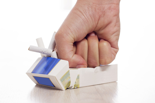 Hand crushing cigarettes - Fotografie, Obrázek