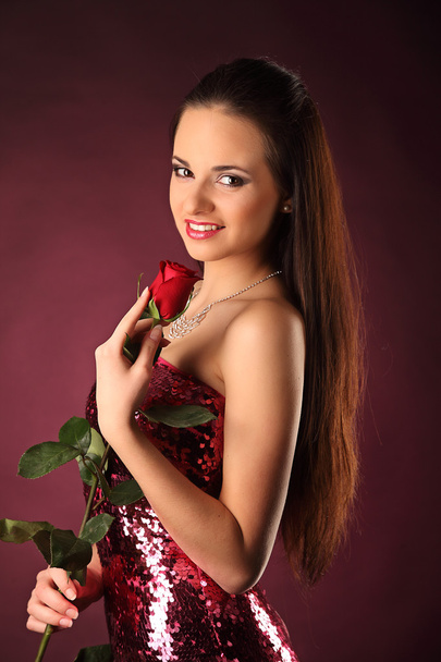 Valentines beautyfull girl with red rose in her hands - Foto, immagini