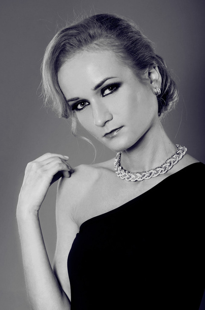 Studio portrait of beautiful blonde woman in elegant black and w - Photo, Image