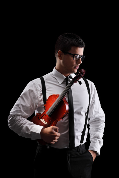 Musician holding a violin - Foto, Imagen
