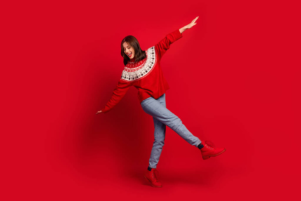 Full body portrait of carefree positive lady enjoy dancing chilling christmastime isolated on red color background. - Φωτογραφία, εικόνα