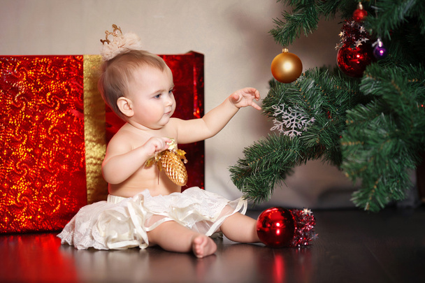 The child at the Christmas tree - Photo, image