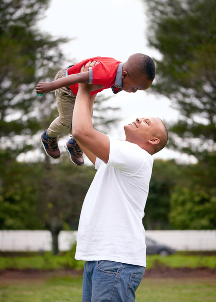 Every minute with him is priceless. a man spending time with his son outdoors - Photo, Image