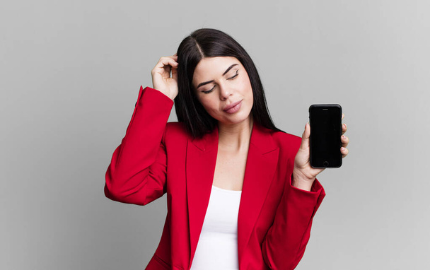 young pretty businesswoman using her smartphone - Фото, зображення