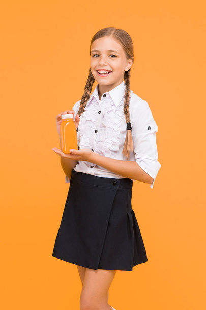 Vegetarian concept. Fruit juice energy. School lunch. Smiling kid drink smoothie. Healthy food. Vitamin nutrition. Fresh smoothie. Girl drinking orange fresh juice smoothie. Schoolgirl having lunch. - Photo, Image