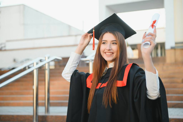 Graduation: Student Standing With Diploma. - Foto, Bild