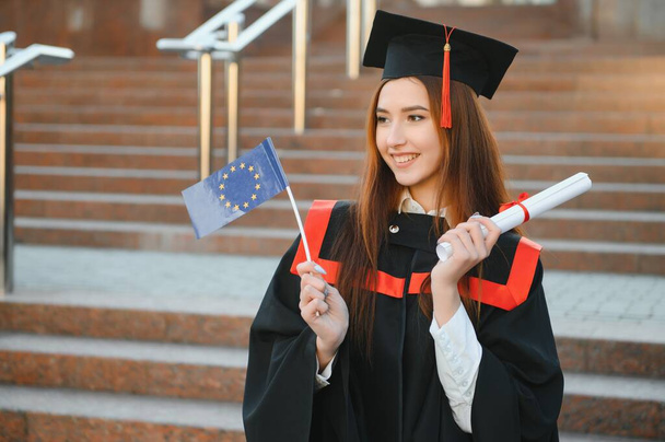 Graduation: Student Standing With Diploma. - Φωτογραφία, εικόνα