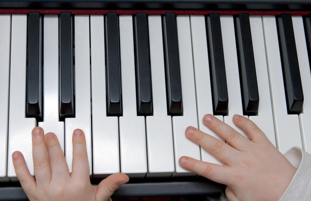 Young boys hands playing piano or keyboard - Photo, Image
