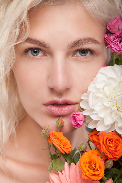 blond girl with flowers - Фото, зображення