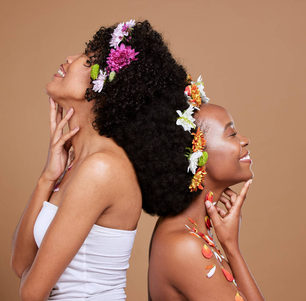 Beauty, skincare and flowers in curly hair of black women for product, luxury and spring. Natural, creative and friends with girl model and art flower crown for self love, hair care and floral. - Foto, Bild