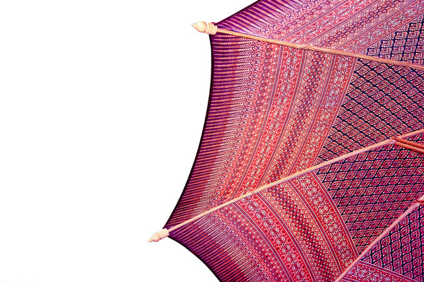 Thailand pattern silk umbrella and sky blue art artist handicraft beach isolated on white background. - Фото, зображення
