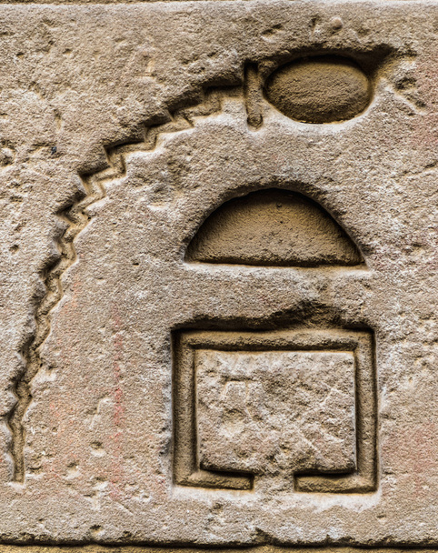 Egyptian hieroglyphs on the wall in a temple - Fotó, kép