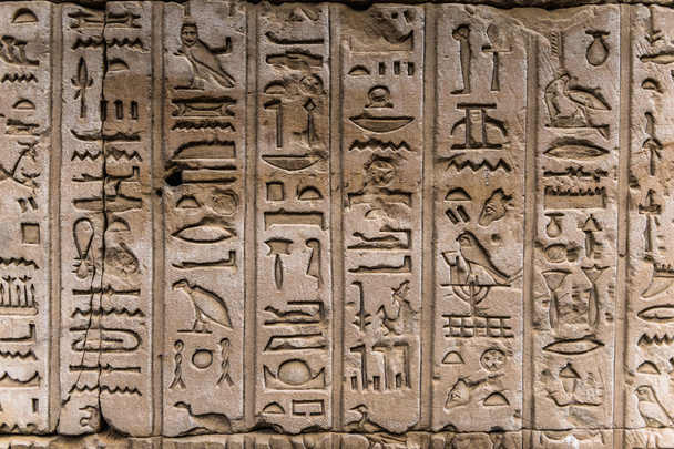 Egyptian hieroglyphs on the wall in a temple - Zdjęcie, obraz