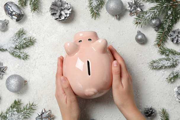 Concept of Christmas finance with piggy bank, top view - Foto, afbeelding
