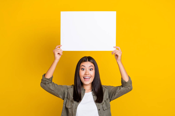 Photo of young crazy excited businesswoman promo opening her first company with low prices clothes fashion isolated on yellow color background. - Photo, image