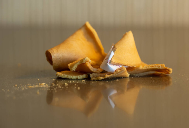Broken Fortune Cookie With Wrapped Up Fortune - Фото, изображение