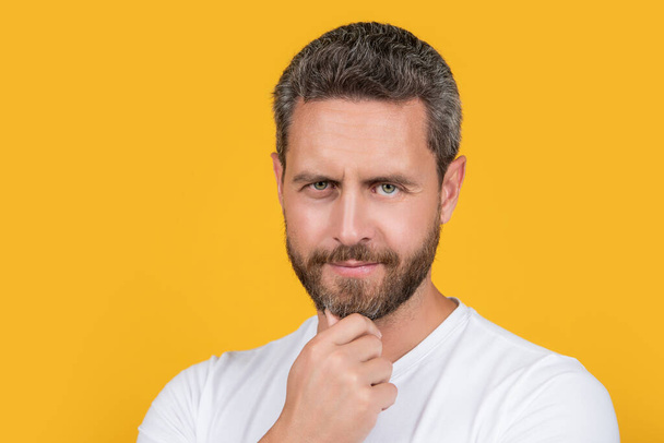 portrait photo of caucasian guy wear white shirt. guy wearing casual style. bearded guy in casual shirt isolated on yellow background. casual guy in studio. - Fotoğraf, Görsel
