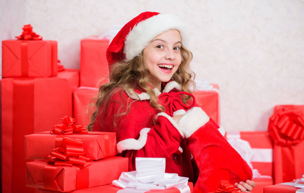 Kid excited about opening christmas present. Girl celebrate christmas. Santa bring her gift. New year holiday tradition. Winter happiness concept. Explore christmas gifts. Unpacking christmas gift. - Valokuva, kuva