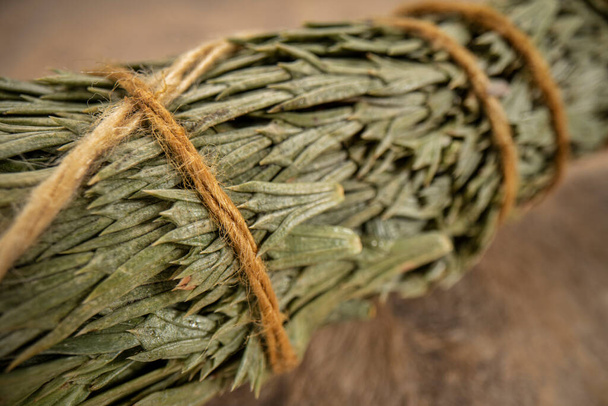 siskiyou cedar incense bundle on a textured bark paper, aromatherapy concept, macro shot - Fotoğraf, Görsel