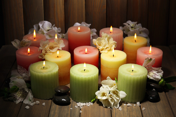 Beautiful candles with flowers on wooden background - Photo, Image