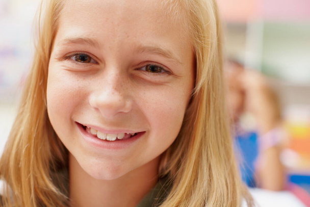 Loving each day, learning new things. Closeup of a cute young primary school girl smiling at the camera - copyspace - Fotoğraf, Görsel