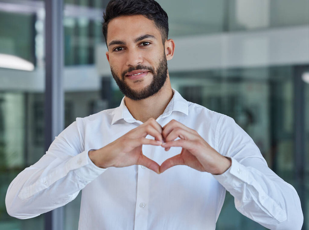 Business man, heart emoji and smile of CEO, boss or leader for charity, support and thank you sign in office with happiness and pride. Portrait of entrepreneur happy about growth, trust and kindness. - Fotografie, Obrázek