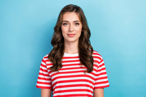 Photo of adorable cheerful young lady wear striped clothes smiling isolated blue color background. - Фото, изображение