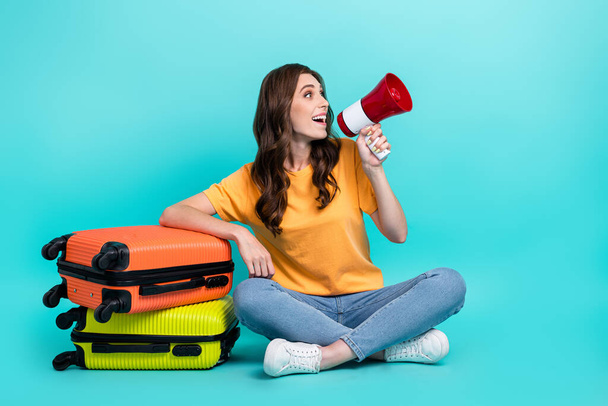Full length photo of cute funky lady wear yellow t-shirt shouting toa packing suitcases isolated turquoise color background. - Φωτογραφία, εικόνα