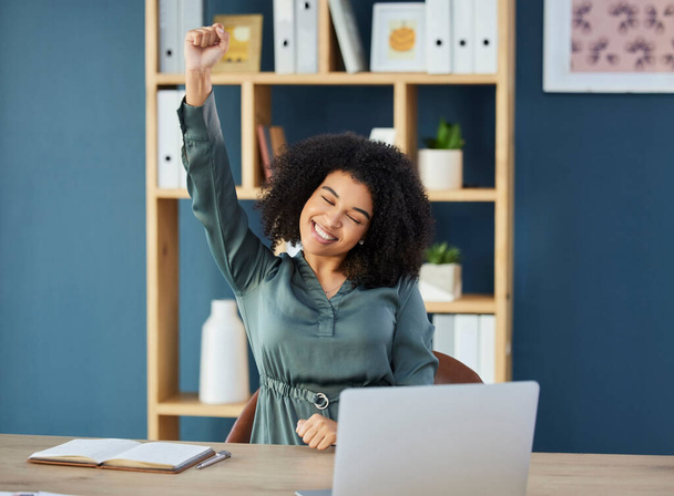 Business woman, laptop and success fist in winner celebration, digital marketing goals or advertising growth target achievement. Smile, happy or creative black woman with arm raised with technology. - Fotoğraf, Görsel