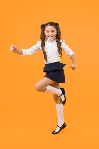 Keep going. Active kid. Girl on way knowledge. Knowledge day. Back to school. Kid cheerful schoolgirl running. Pupil want study. Active child in motion. Freedom concept. Knowledge determined success. - Фото, зображення