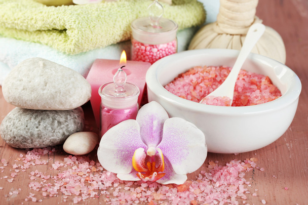 Spa treatments with orchid flower on wooden table on colorful background - Φωτογραφία, εικόνα