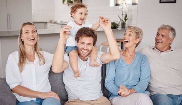 Playful, portrait and big family on the living room sofa during a visit from grandparents. Love, smile and baby bonding with his parents and senior man and woman on the couch in happiness together. - Fotografie, Obrázek