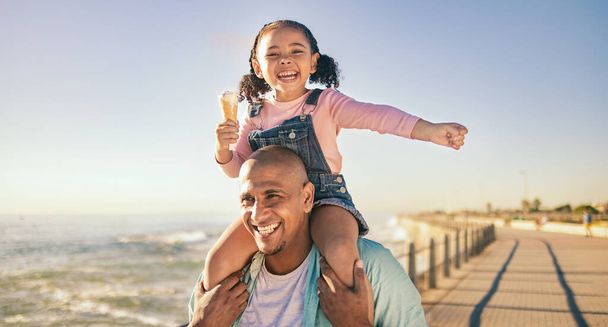 Family, children and piggyback with a father and daughter eating ice cream while walking on the promenade together. Sky, nature and kids with a man and girl bonding with the sea or ocean at the beach. - Fotoğraf, Görsel
