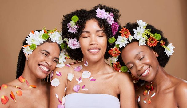Beauty, diversity and flowers for natural hair and skincare in studio with women friends together for luxury spa and dermatology mockup. Aesthetic black women happy about organic spring plant product. - Fotografie, Obrázek