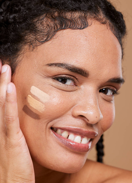 Makeup, black woman and face with tone cream lines, skincare and smile on brown studio background. Cosmetics, African American girl and young female with healthy skin, contouring smears and portrait. - Foto, afbeelding