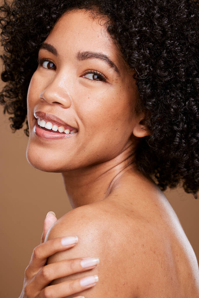 Beauty, skincare and face portrait of black woman with self care wellness, natural cosmetics and luxury facial makeup. Dermatology, healthcare and aesthetic African model isolated on brown background. - 写真・画像