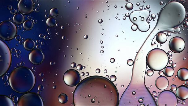 Abstract Colorful Food Oil Drops Bubbles and spheres Flowing on Water Surface Macro Photography - Photo, Image
