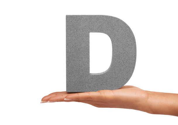 Have a nice Day. A young woman holding a capital letter D isolated on a white background - Foto, immagini