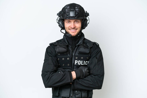 SWAT man over isolated white background keeping the arms crossed in frontal position - Zdjęcie, obraz