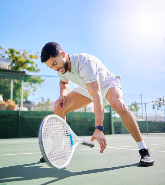 Sports, tennis and leg injury on court after training, game or match. Tennis player, healthcare and male athlete drop racket with injured knee, muscle pain or inflammation after workout or exercise - Photo, Image