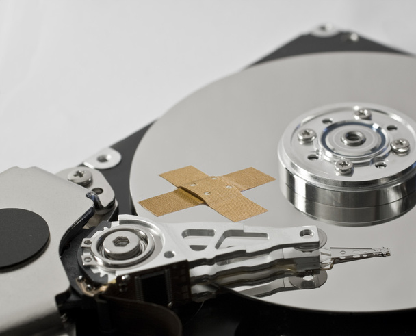 Hard disk drive with band-aid - Photo, Image