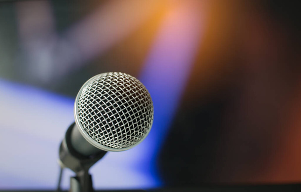 Microphone on abstract blurred of speech in seminar room or speaking conference hall light, Event concert bokeh background - Photo, Image
