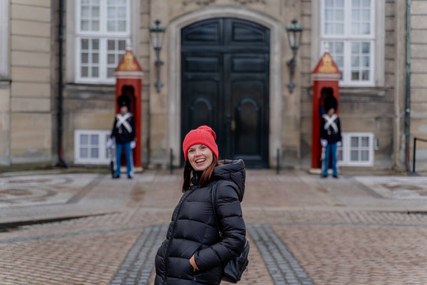 Travel. A woman walks around the city of Copenhagen. Denmark. - Zdjęcie, obraz