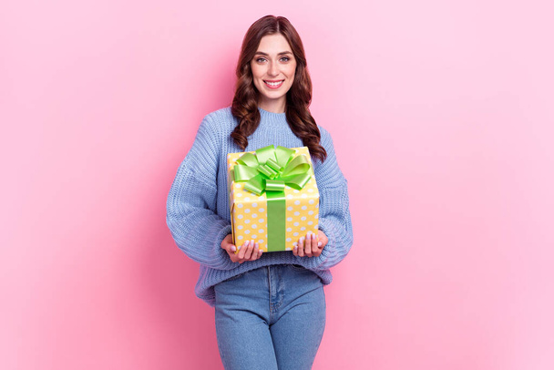 Photo of gorgeous positive girl toothy smile arms hold giftbox isolated on pink color background. - Φωτογραφία, εικόνα