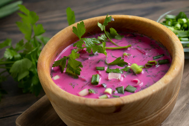 Cold beetroot soup on wooden background - Photo, Image