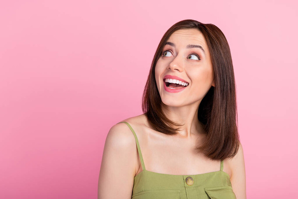 Photo of funny brunette lady look promo wear khaki top isolated on pink color background. - 写真・画像
