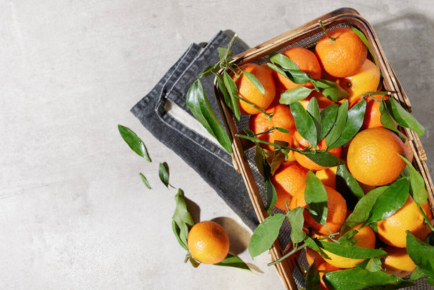 winter flat lay with tangerines in basket. - Fotó, kép