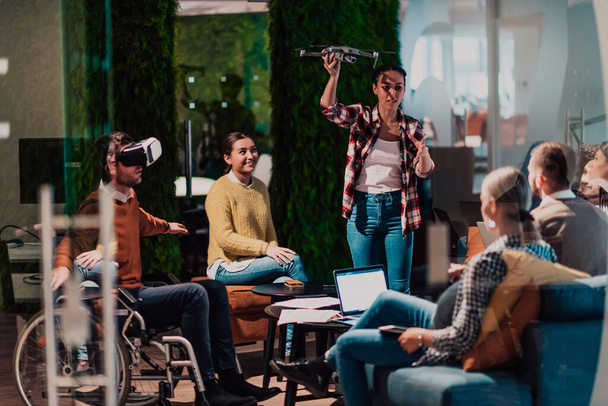 Business persons with a disability at work in modern open space coworking offices on team meetings using virtual reality goggles. High quality photo - Foto, Imagem
