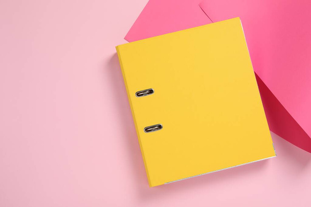 Yellow office folder on pink background, top view. Space for text - Foto, afbeelding