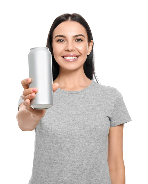 Beautiful happy woman holding beverage can on white background - Zdjęcie, obraz